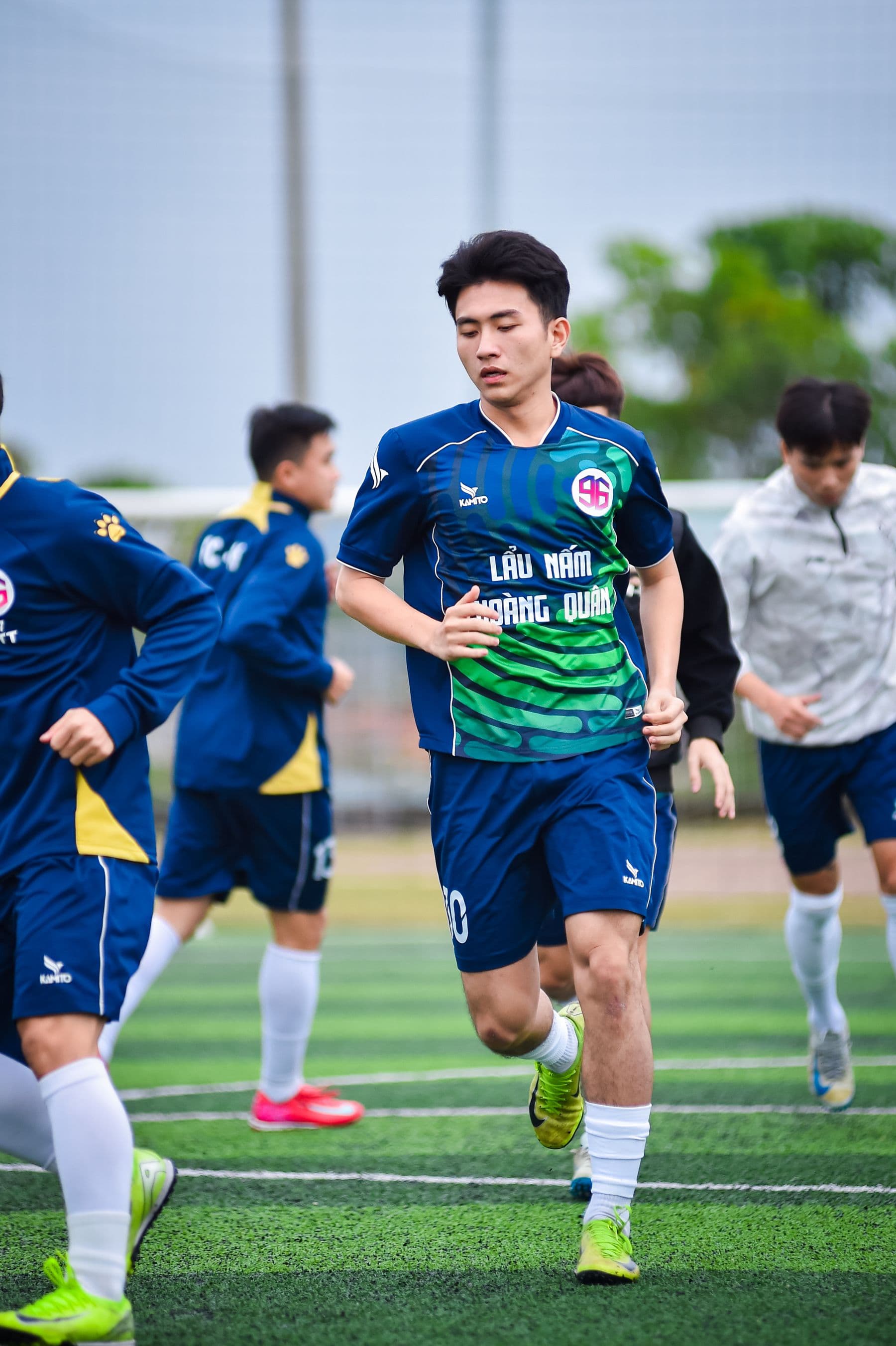 Young footballers training together on an outdoor pitch