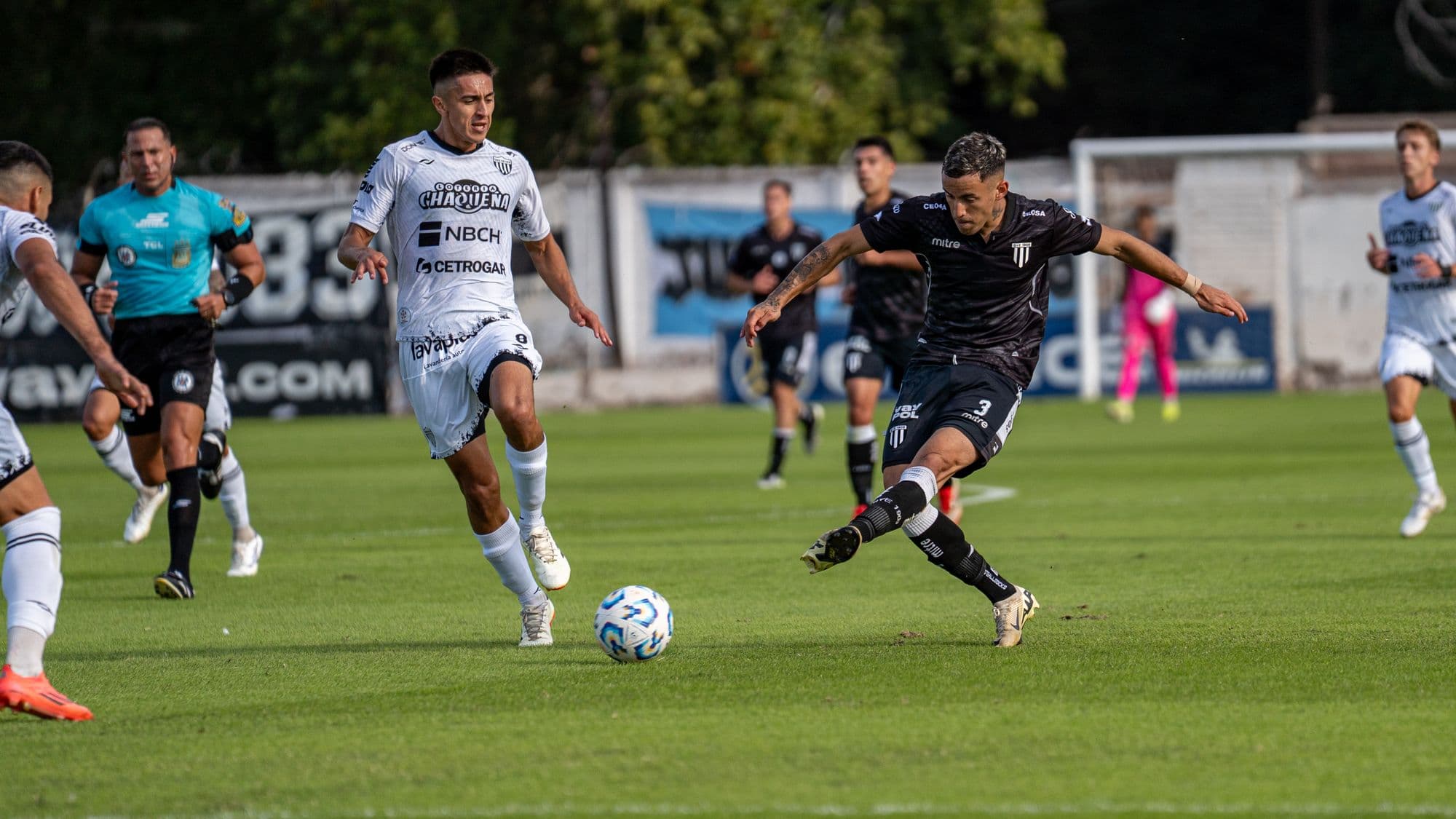 Football players competing for the ball during a match